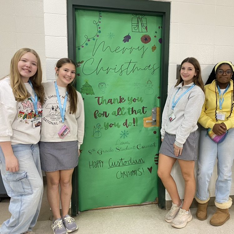 Students pictured with Custodian 