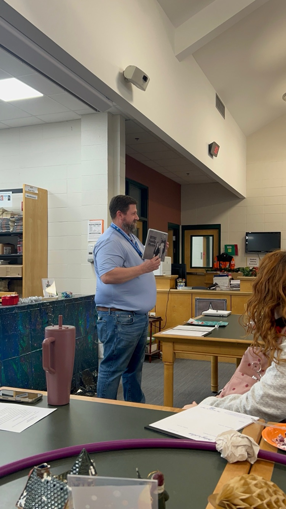 Staff members pose for classic photo shoot