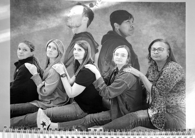 Staff members pose for classic photo shoot