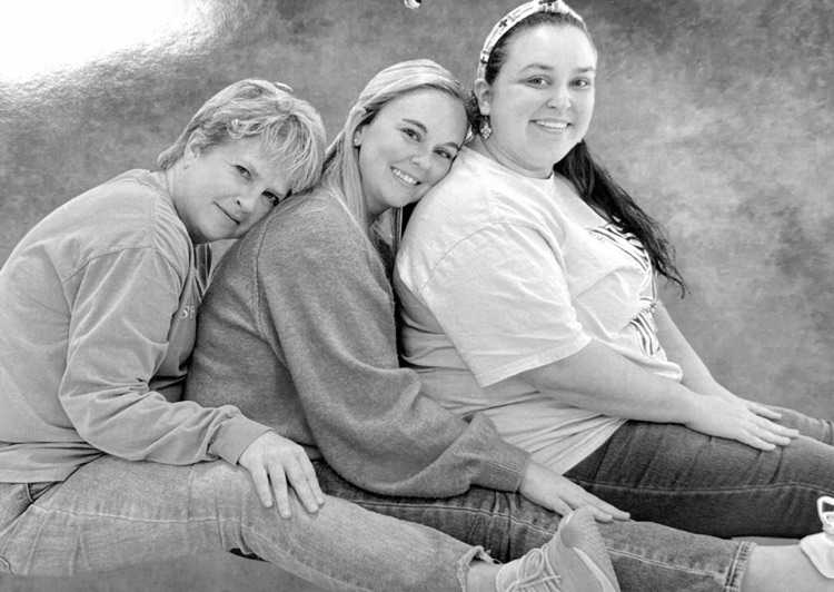 Staff members pose for classic photo shoot