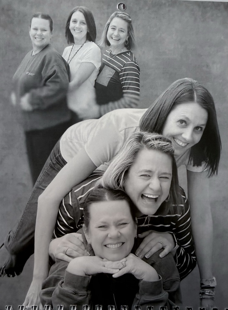 Staff members pose for classic photo shoot