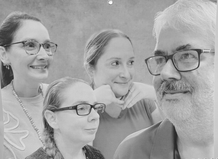 Staff members pose for classic photo shoot