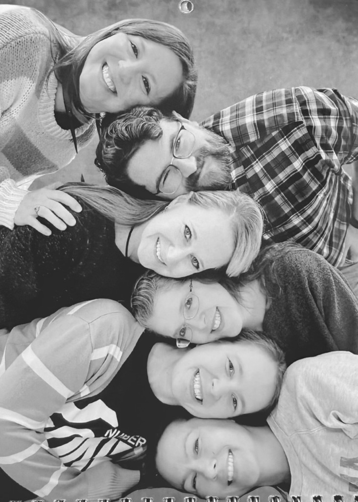 Staff members pose for classic photo shoot