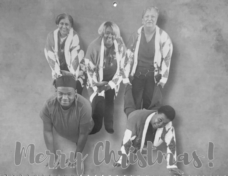 Staff members pose for classic photo shoot