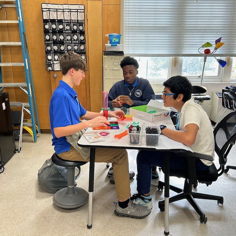 Students create marble run puzzles. 