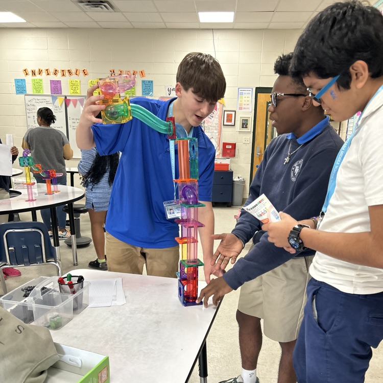 Students create marble run puzzles. 