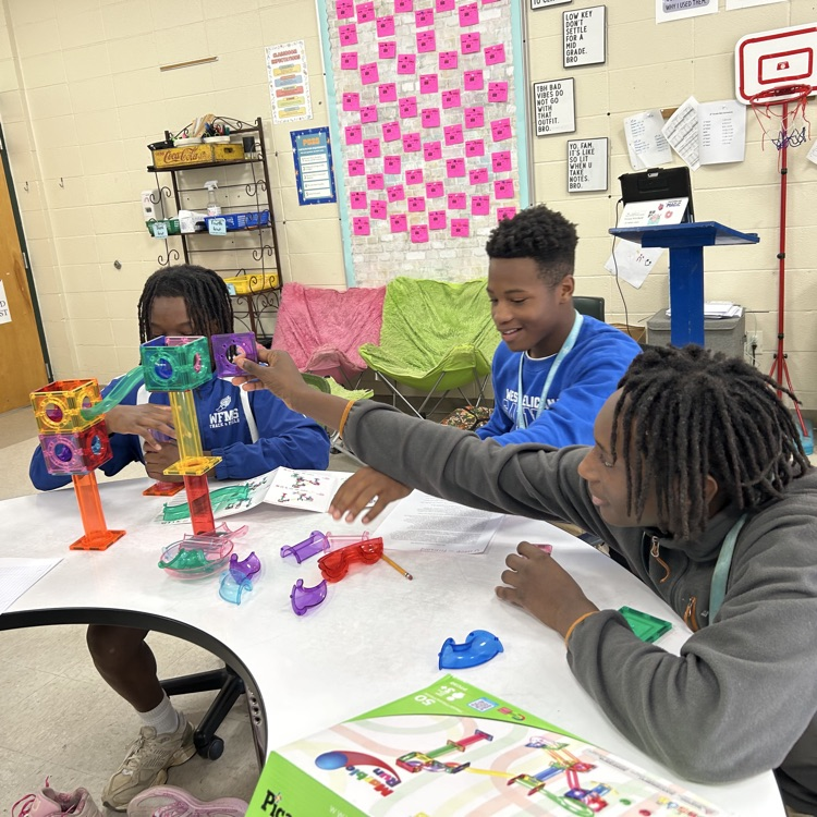 Students create marble run puzzles. 