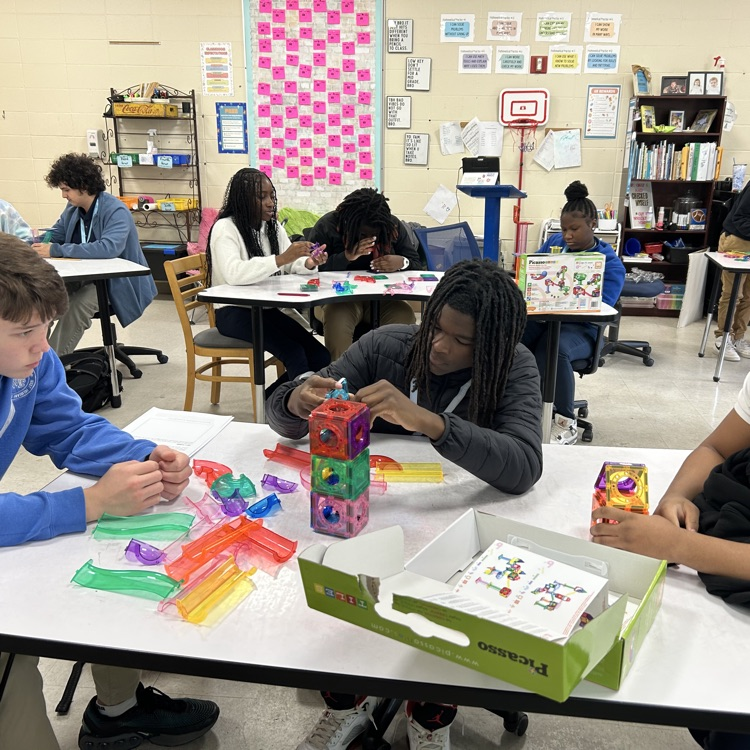 Students create marble run puzzles. 