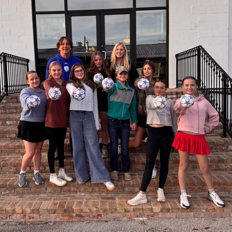 Group photo featuring girls on the soccer team.