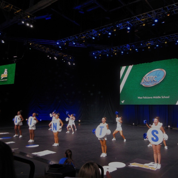 dance team performs on stage
