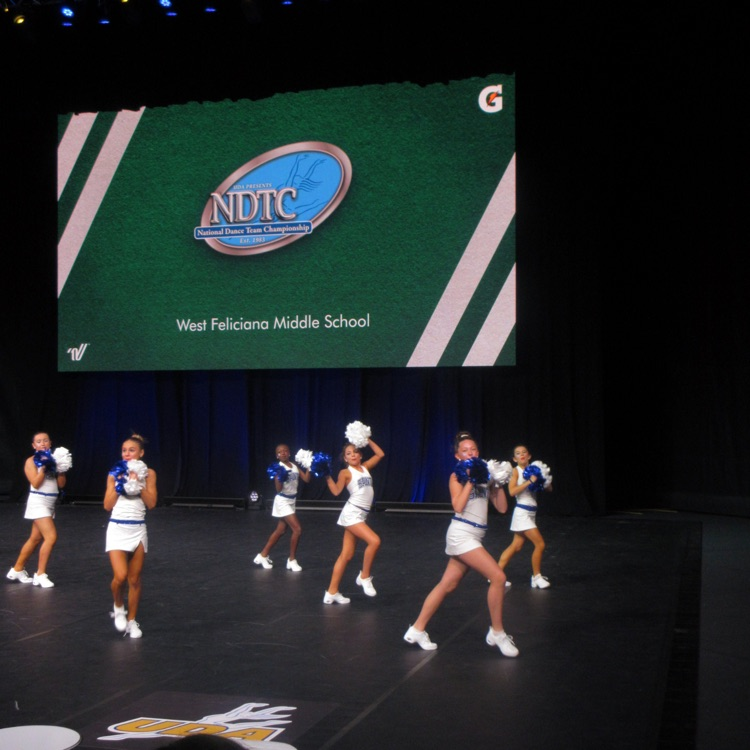 dance team performs on stage