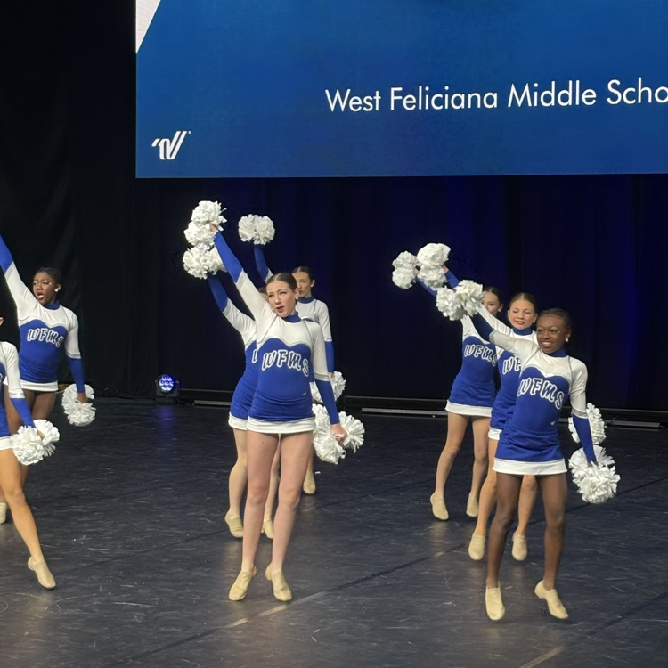 dance team performs on stage