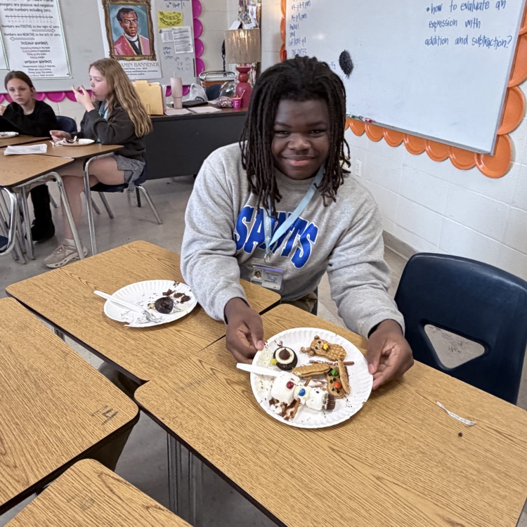 student shows off his creation