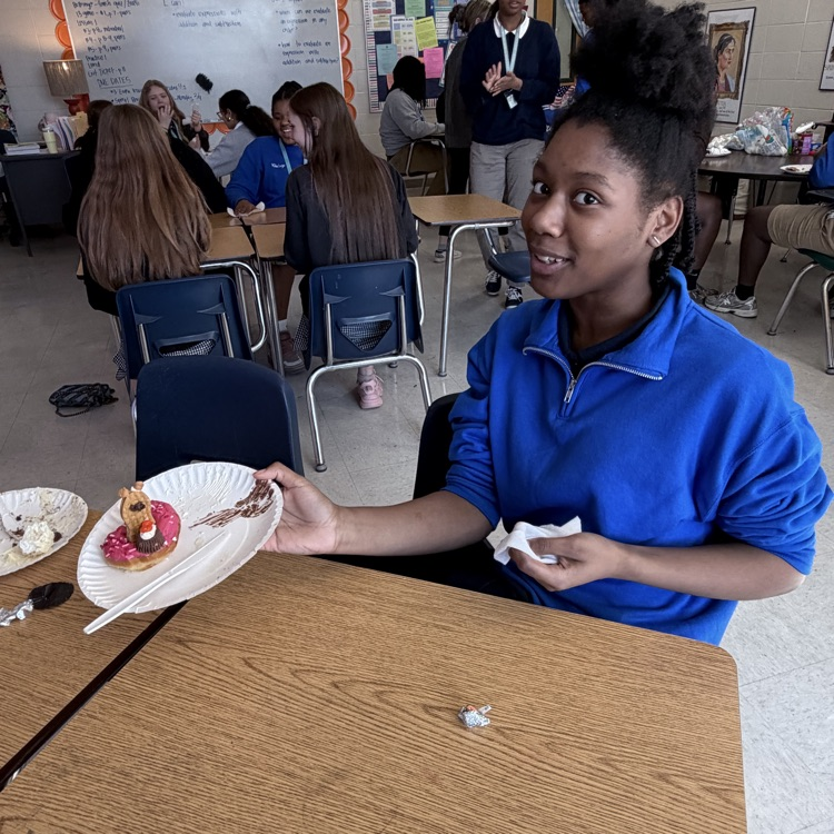 student shows off her creation