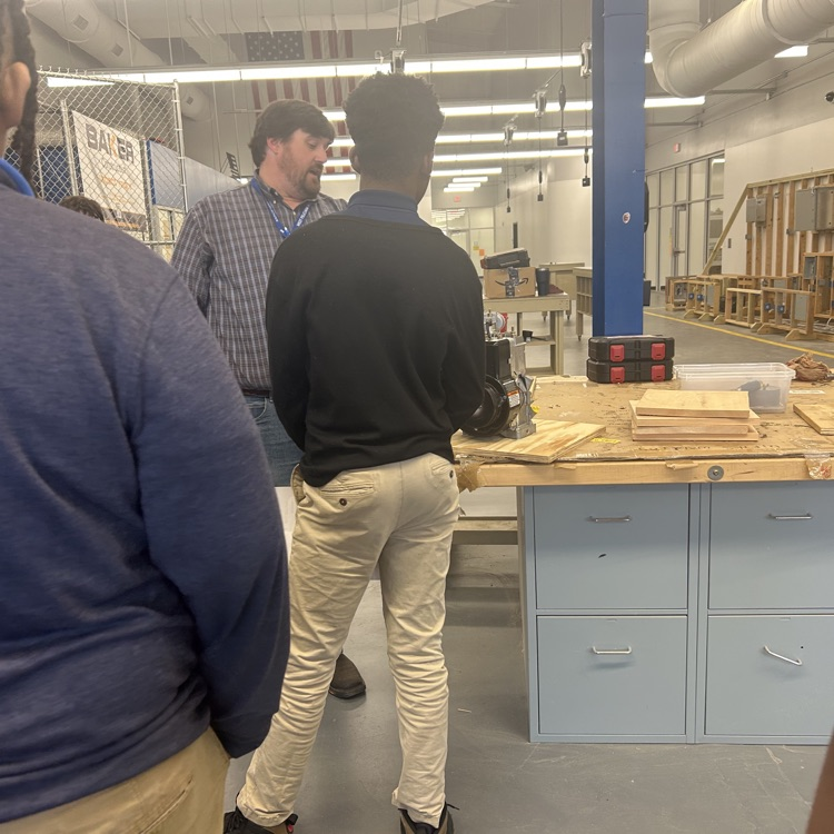 students tour the carpentry shop