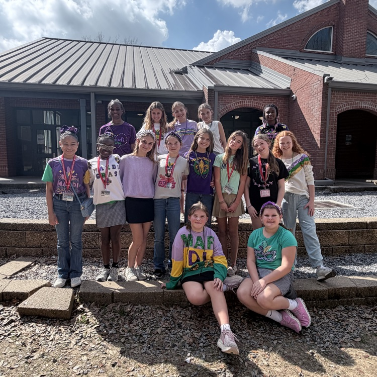 students dress for Mardi Gras. 