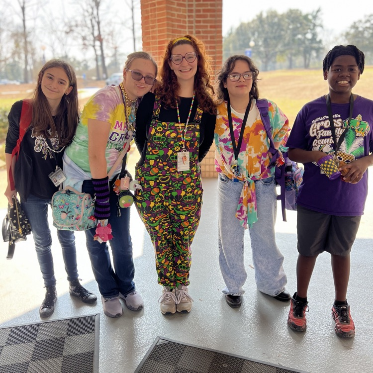 students dress for Mardi Gras. 
