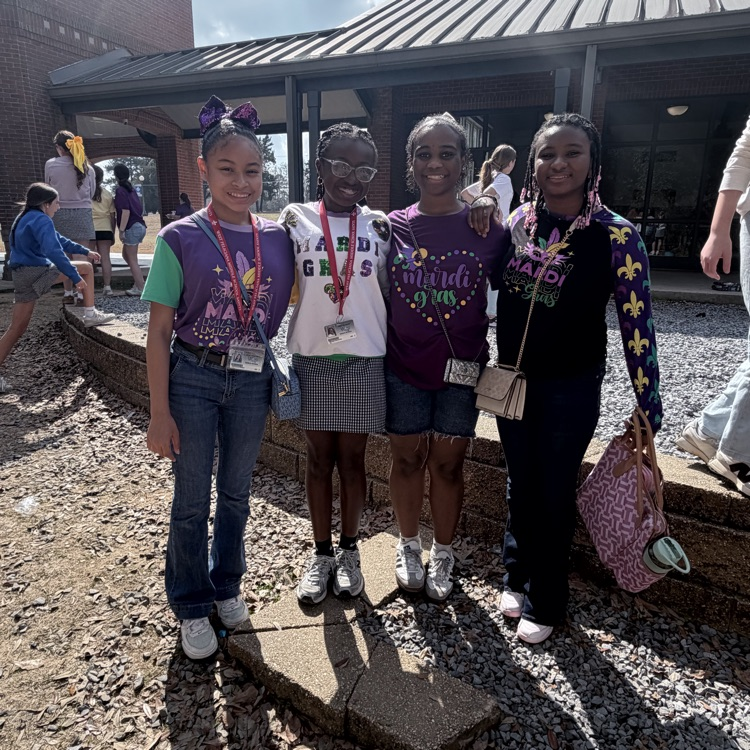 students dress for Mardi Gras. 