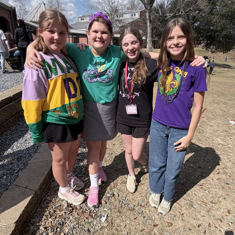 students dress for Mardi Gras. 