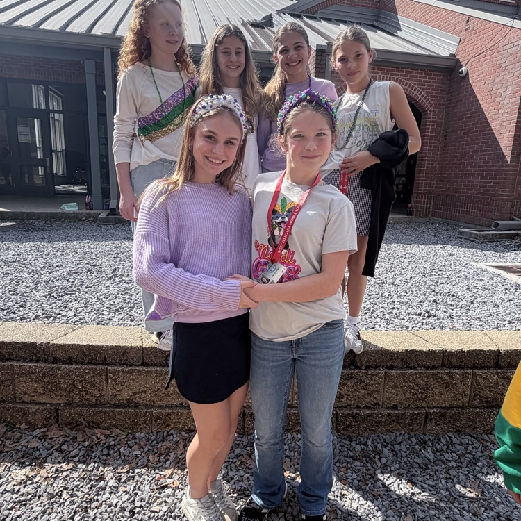 students dress for Mardi Gras. 
