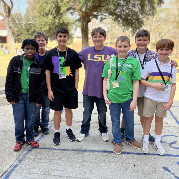 students dress for Mardi Gras. 