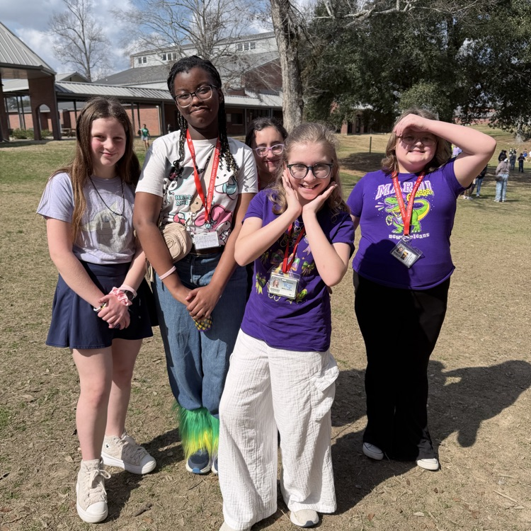 students dress for Mardi Gras. 