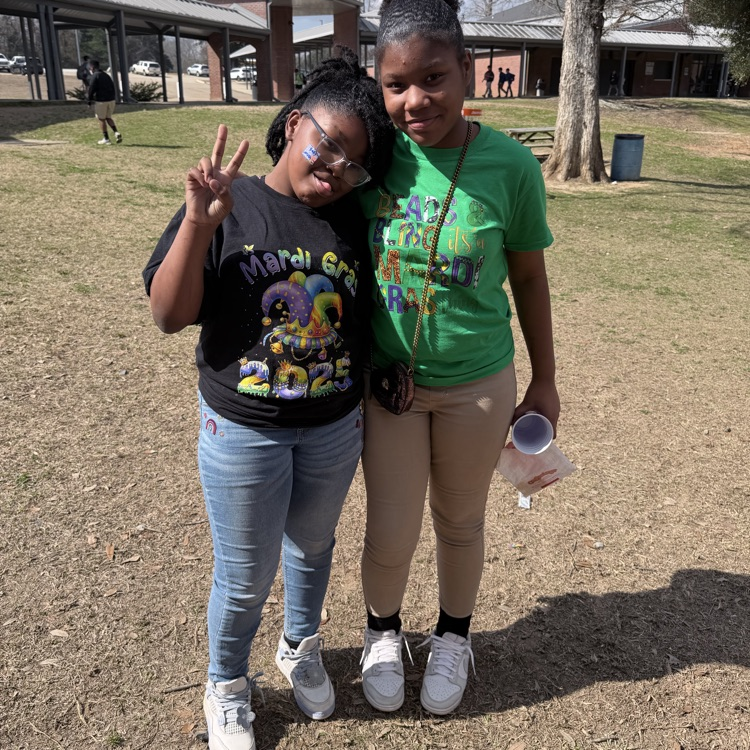 students dress for Mardi Gras. 