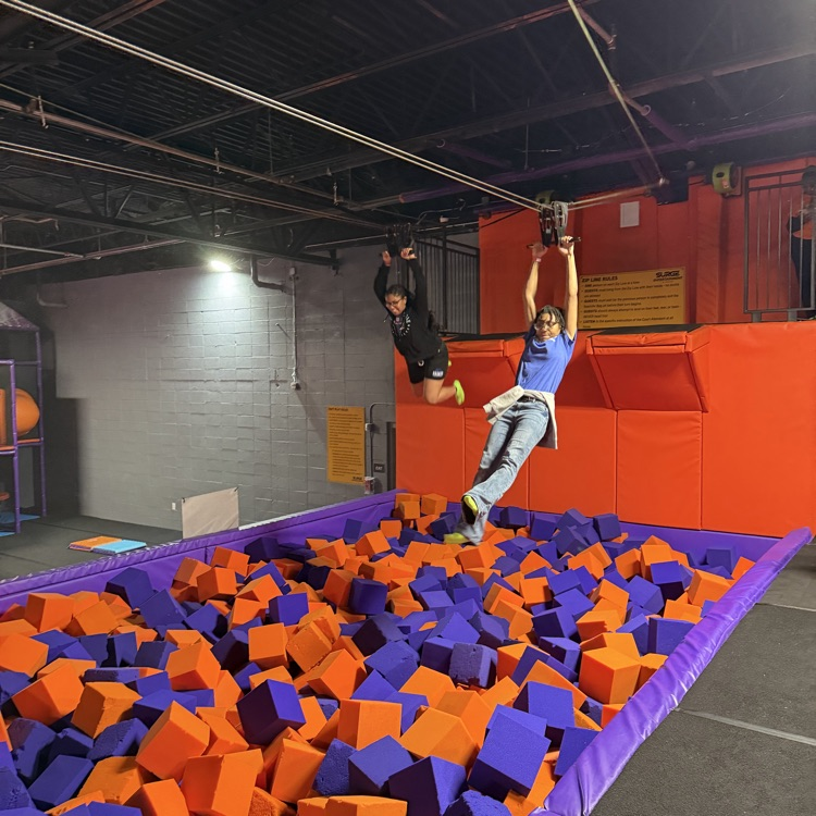 students use a zip line