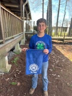 Judah Lowery stands with banner