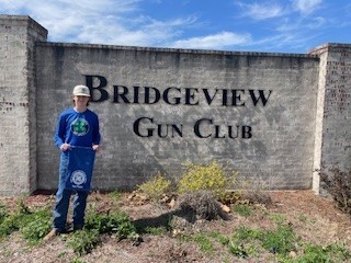 Andrew Klein stands with banner