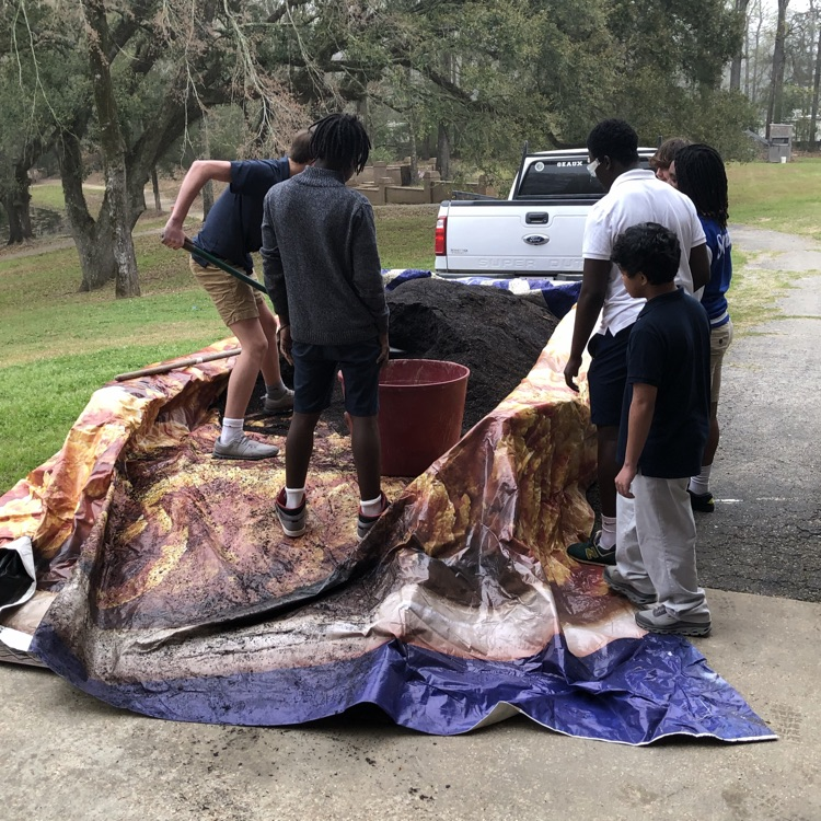 students move soil to plant trees