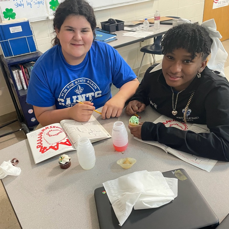 students eat cupcakes 