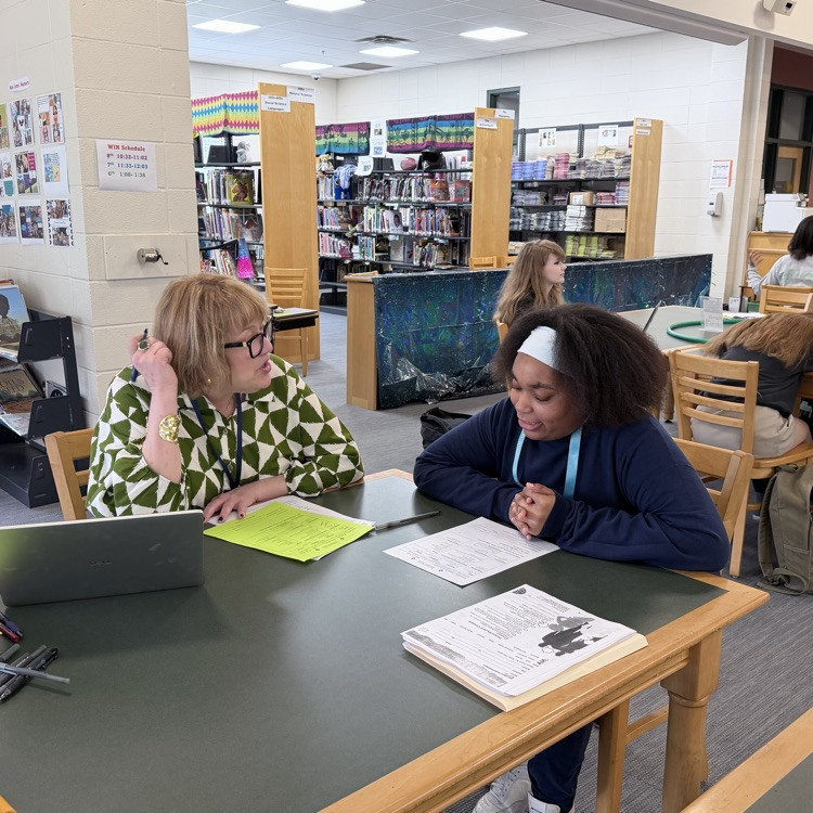 student meets with high school counselor