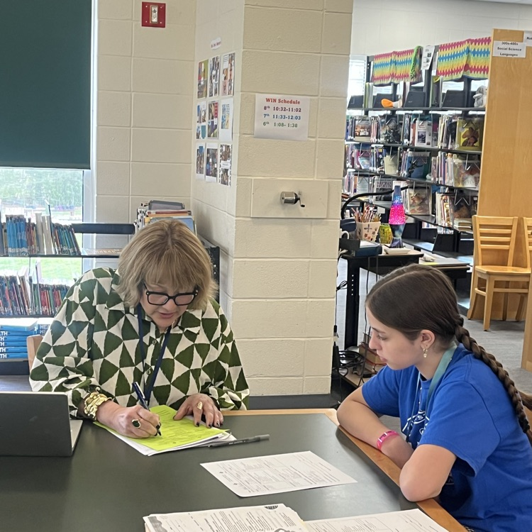 student meets with high school counselor