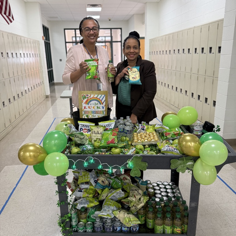 Teachers choose a treat off the cart  