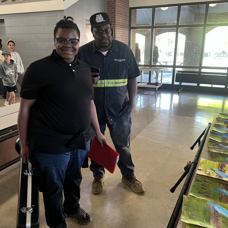 Student shows his dad artwork  