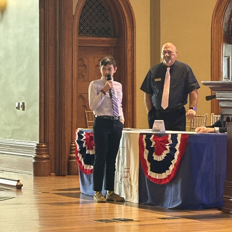 Student speaking at podium 