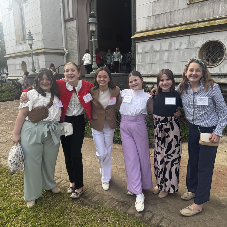 Students pictured in front of old state capitol