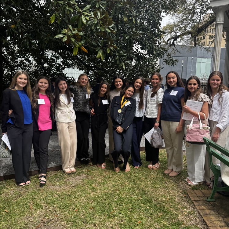 Students pictured in front of old state capitol