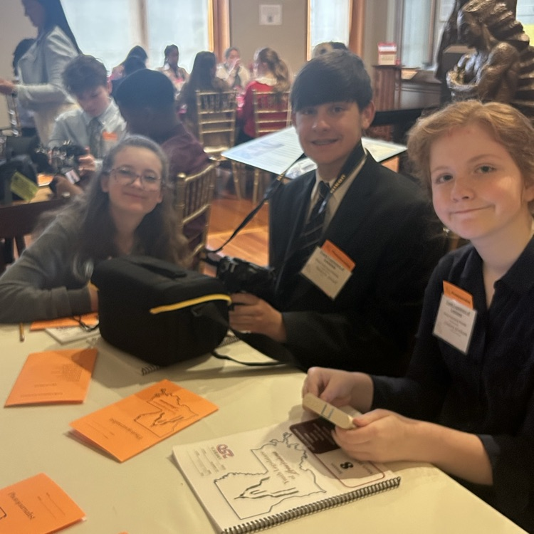 Lindsey & Andre seated at table 