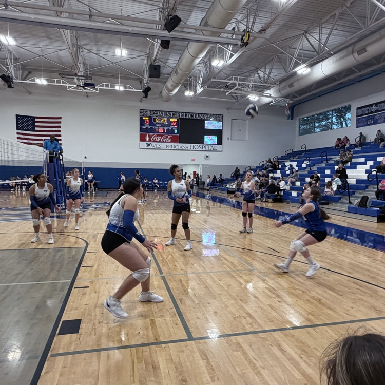 Players at a volleyball game. 