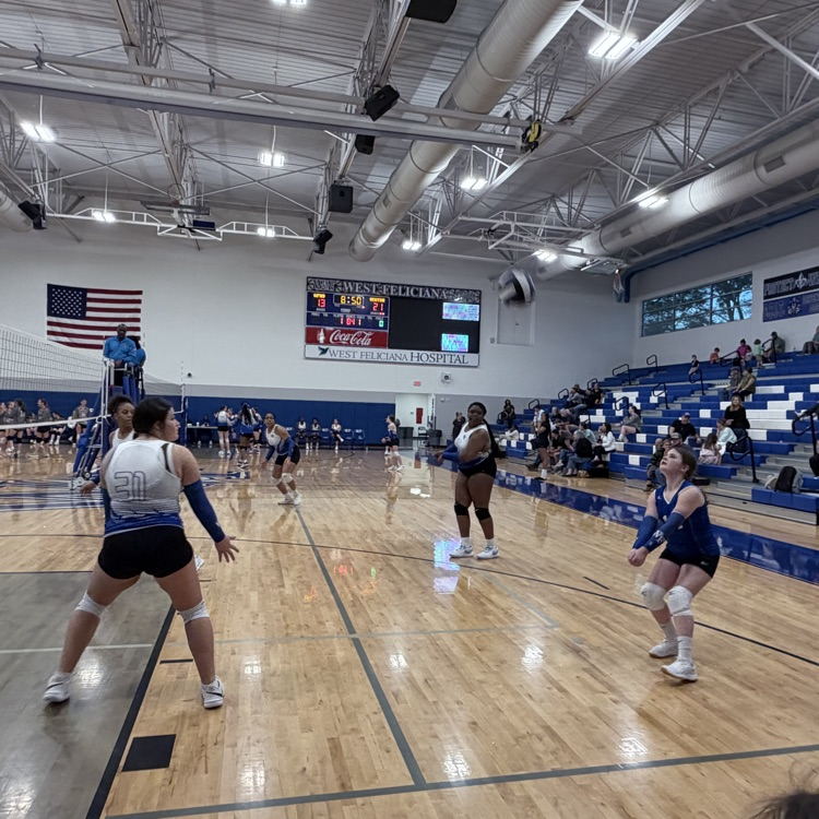 Players at a volleyball game. 