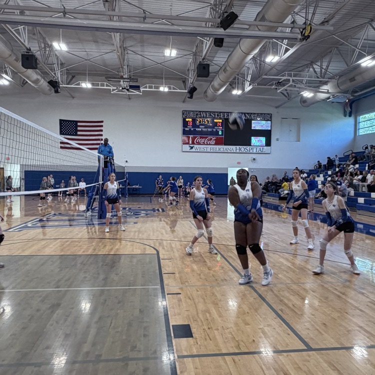 Players at a volleyball game. 