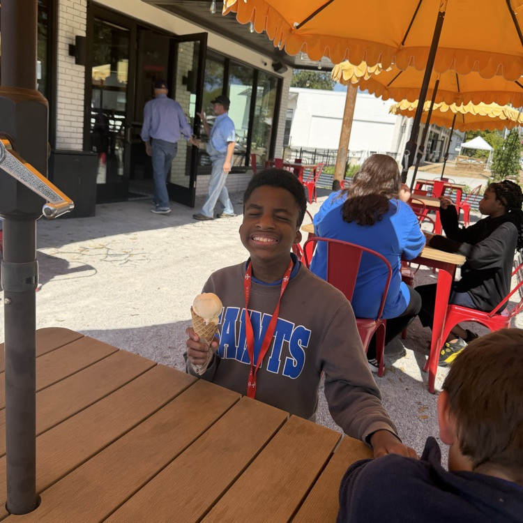 student enjoys an ice cream treat on a field trip