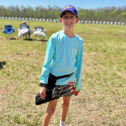 Archery students pose for photo  