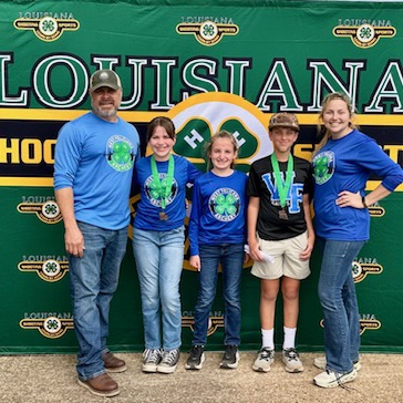Archery students pose for photo  