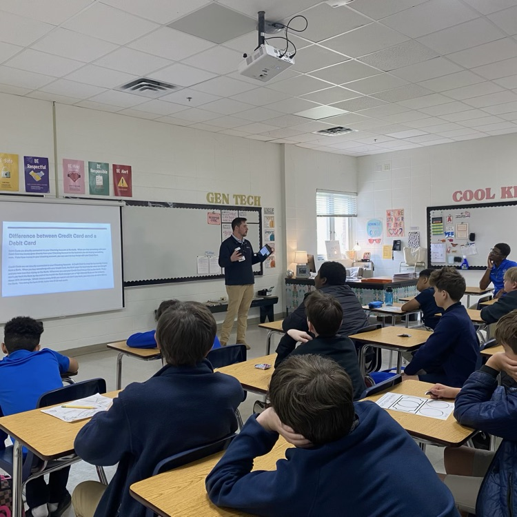 Mr. Ness speaks to class