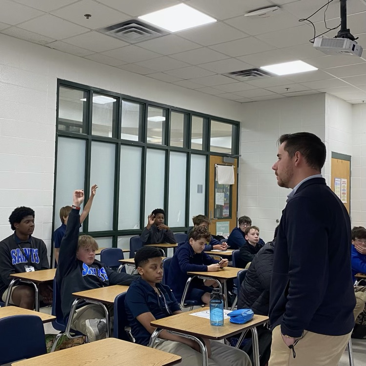 Mr. Ness speaks to class