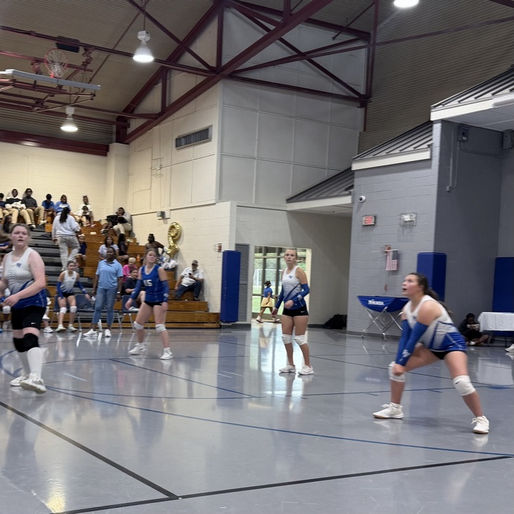 Athletes on volleyball court