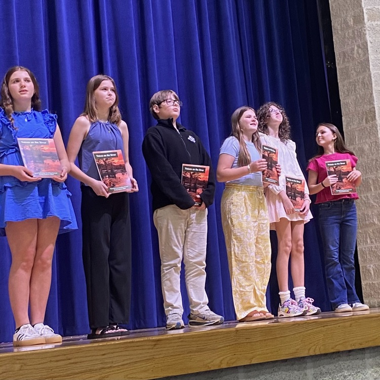 winners of the young authors contest take the stage